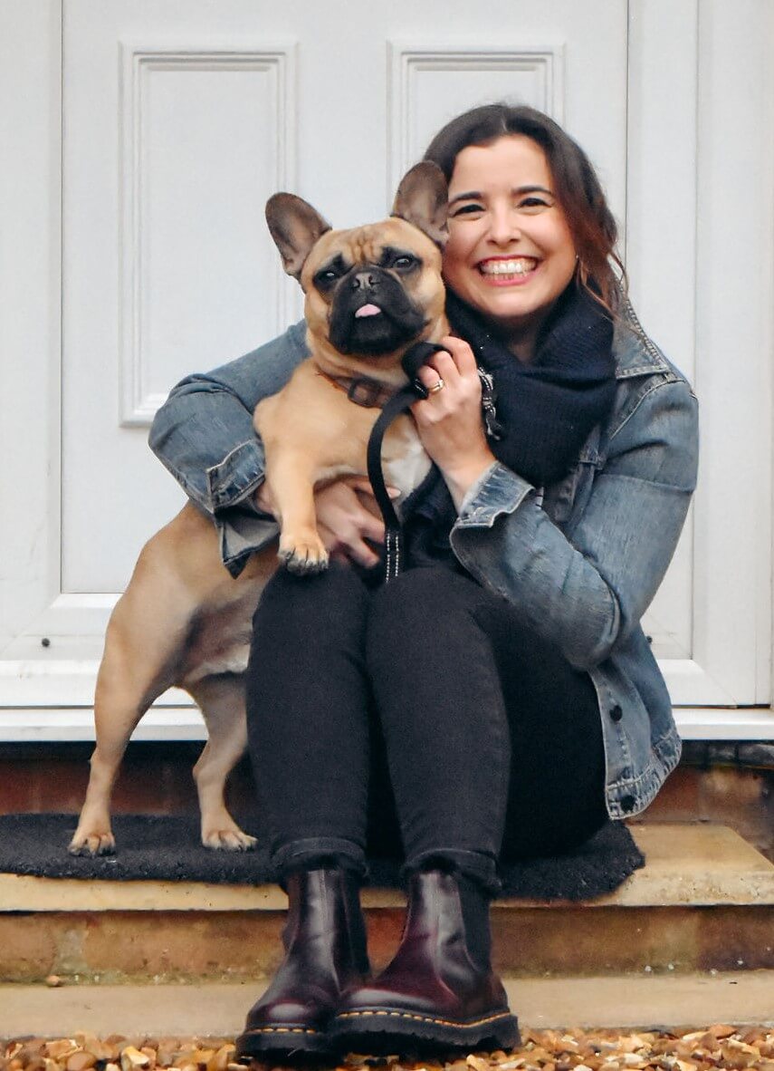 Frannie from Sound More French sitting on a doorstep with her French Bulldog