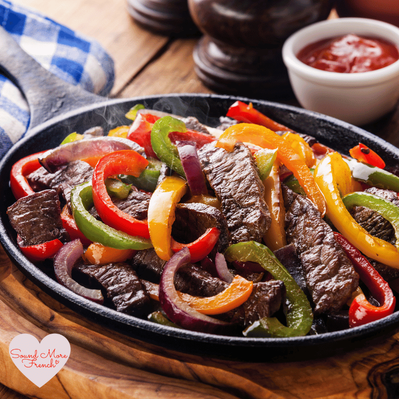 1 Sizzling beef fajitas with colourful peppers and onions, inspired by French phrases on a spice packet.