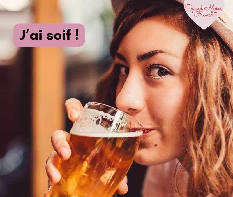 young_woman_in_hat_drinking_glass_of_beer_with_text_j_ai_soif