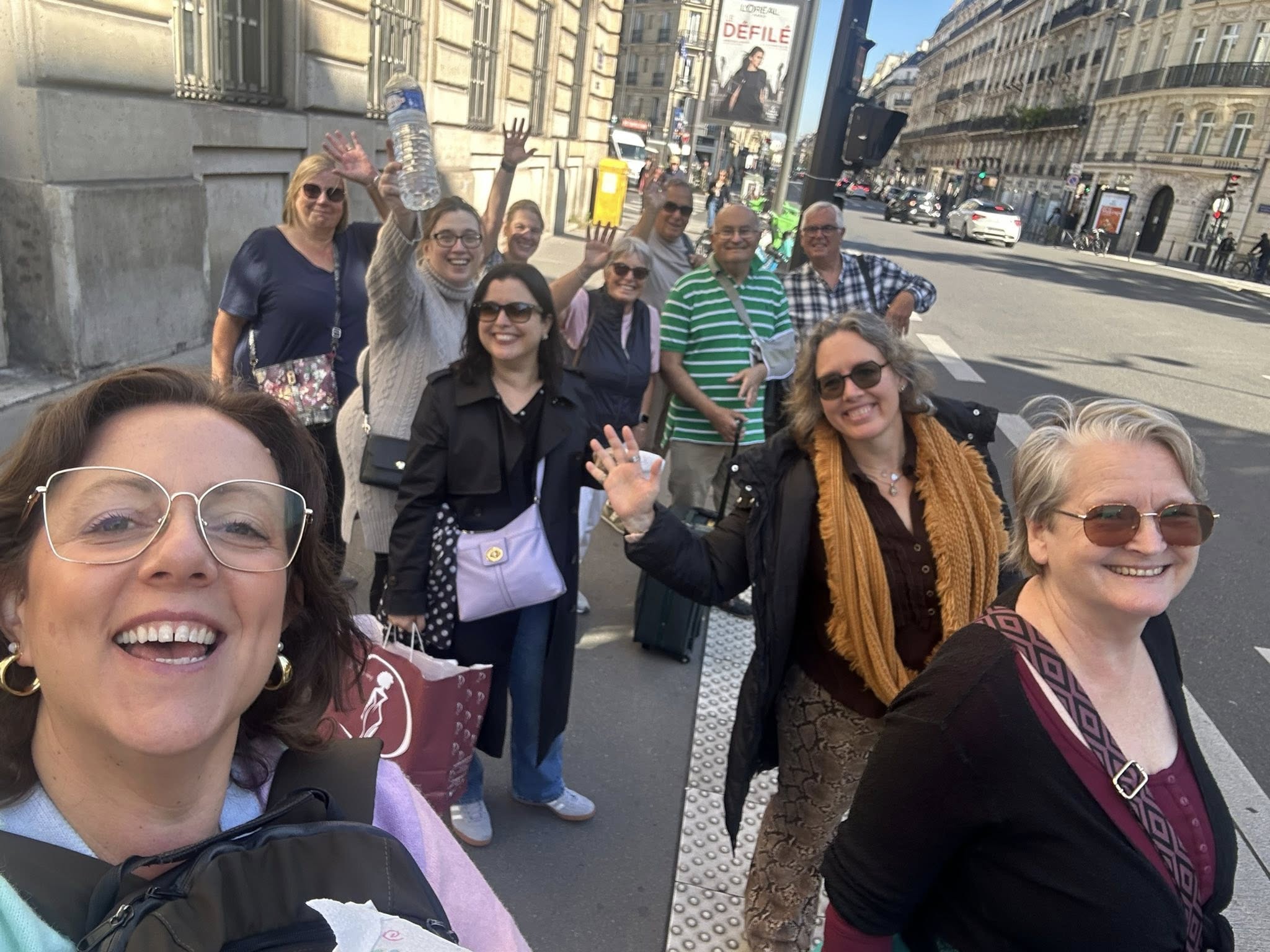 group at raspail The_Café_Cats_in_Paris_waving_happily_while_exploring_the_city_streets_together