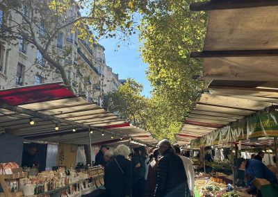 Bustling_stalls_at_Marché_Raspail_visited_by_the_Café_Cats_in_Paris_for_a_Sunday_morning_stroll