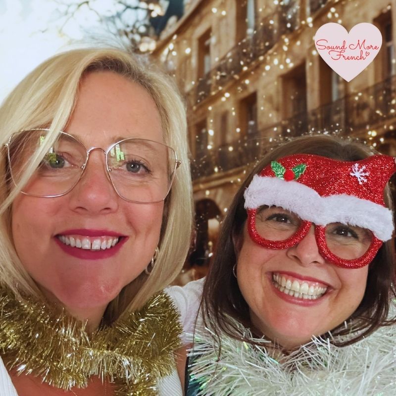 sales page pic frannie_and_judith_smiling_in_christmas_tinsel_with_festive_glasses_parisian_background_sound_more_french_logo