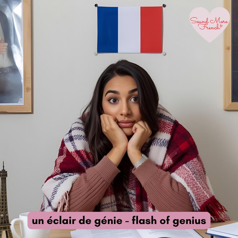 woman_wrapped_in_a_blanket_sitting_at_a_desk_looking_cold_french_flag_on_wall_sound_more_french_logo_un_eclair_de_genie_text