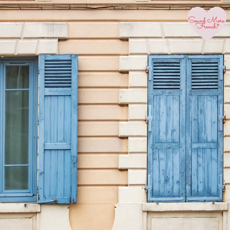 cream_and_peach_french_building_with_blue_shutters_closed_and_open_sound_more_french_logo