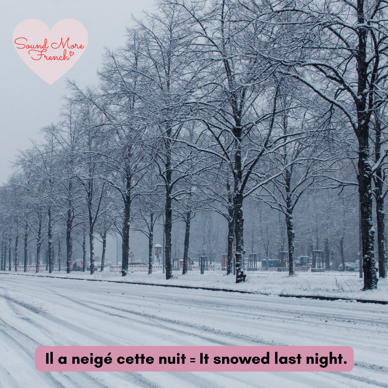 Snow_covered_road_lined_with_bare_trees_after_a_night_of_snowfall_with_text_il_a_neige_cette_nuit_it_snowed_last_night