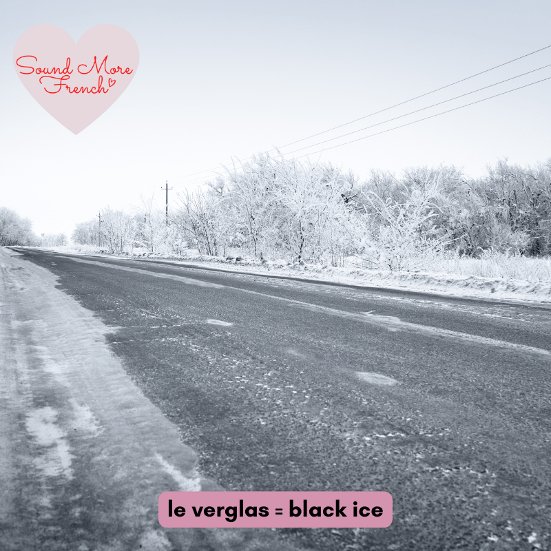 Icy_road_with_visible_black_ice_on_a_winter_day_with_frosted_trees_and_text_le_verglas_black_ice