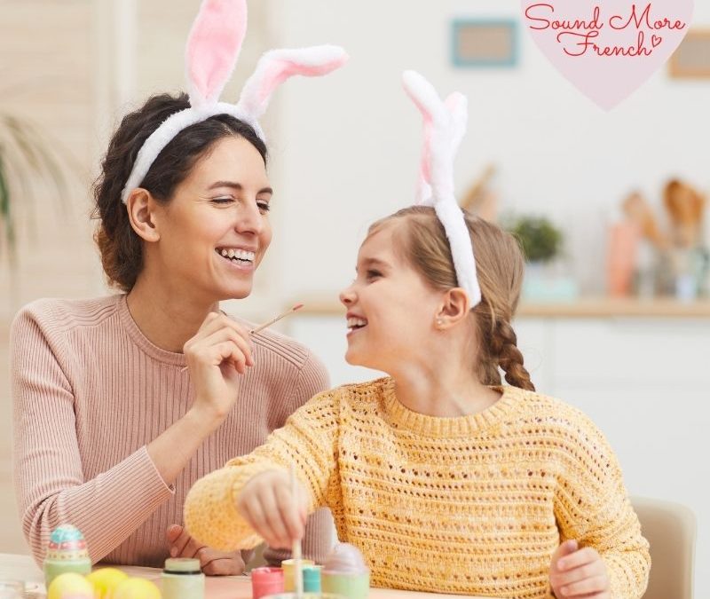 Sound More French Easter activity with woman and child wearing bunny ears painting Easter eggs together