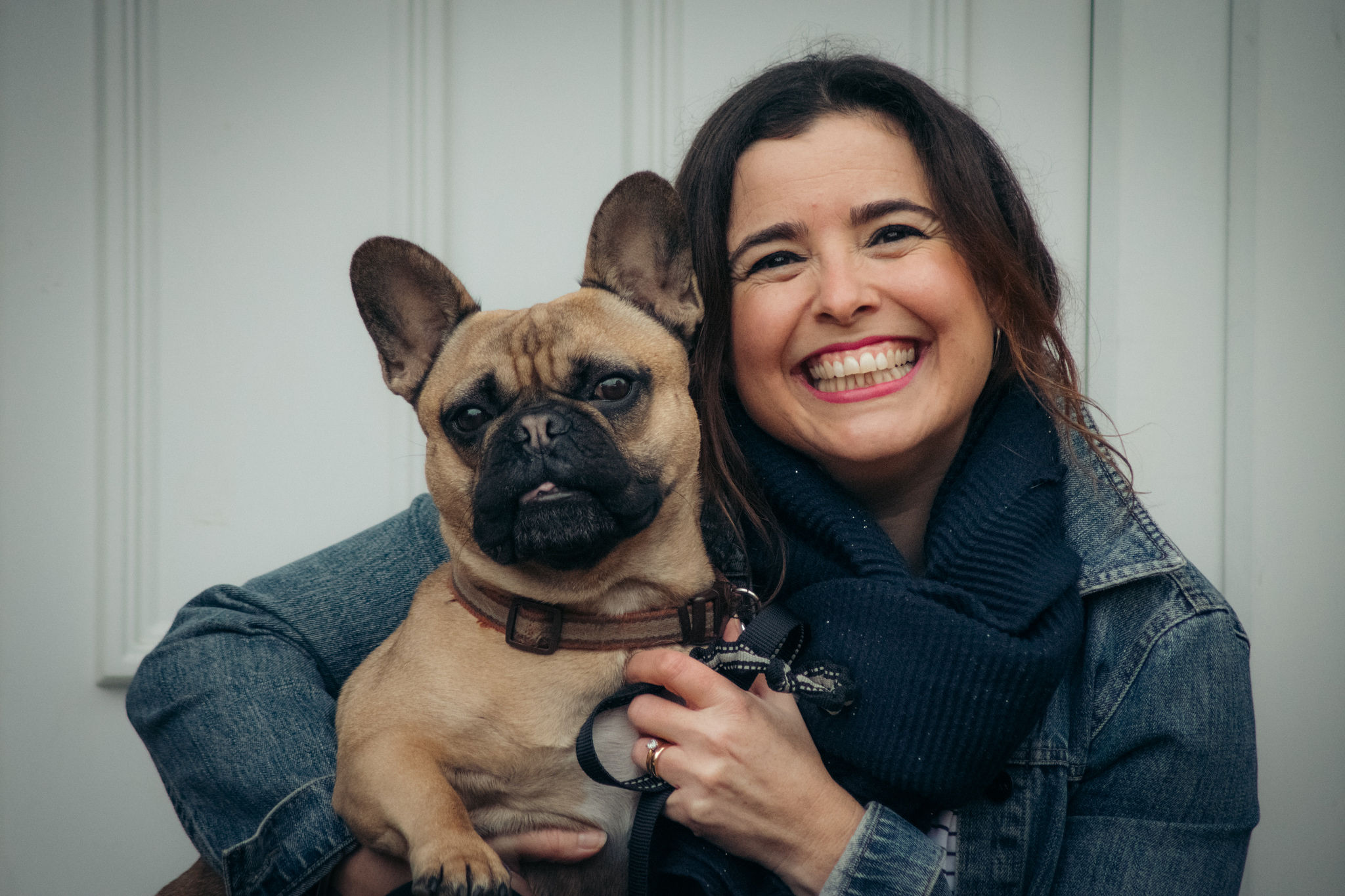 Frannie_smiling_at_the_camera_with_her_dog_Edie_in_her_arms